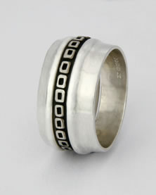 Three silver band 'Stacking Ring', the central one oxidizes with little square box design.